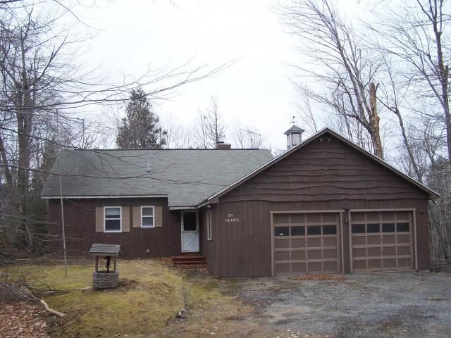 95 Slope Road Tolland, MA 01034 - Photo 2 of 18 a front view of a house with a yard