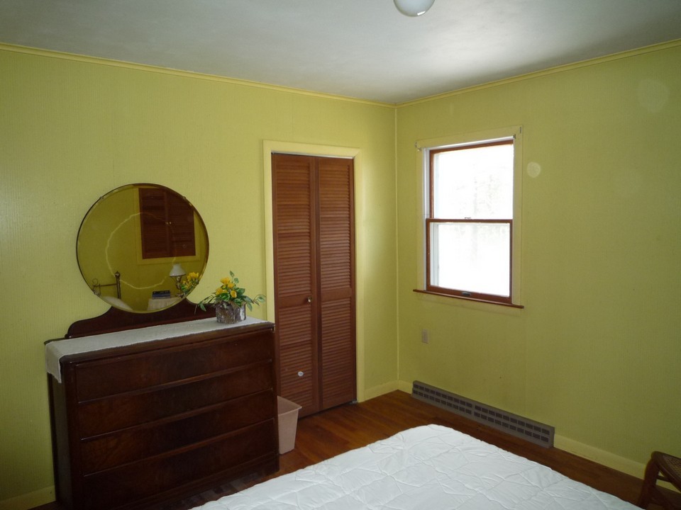 95 Slope Road Tolland, MA 01034 - Photo 12 of 18 a bedroom with a bed and a dresser