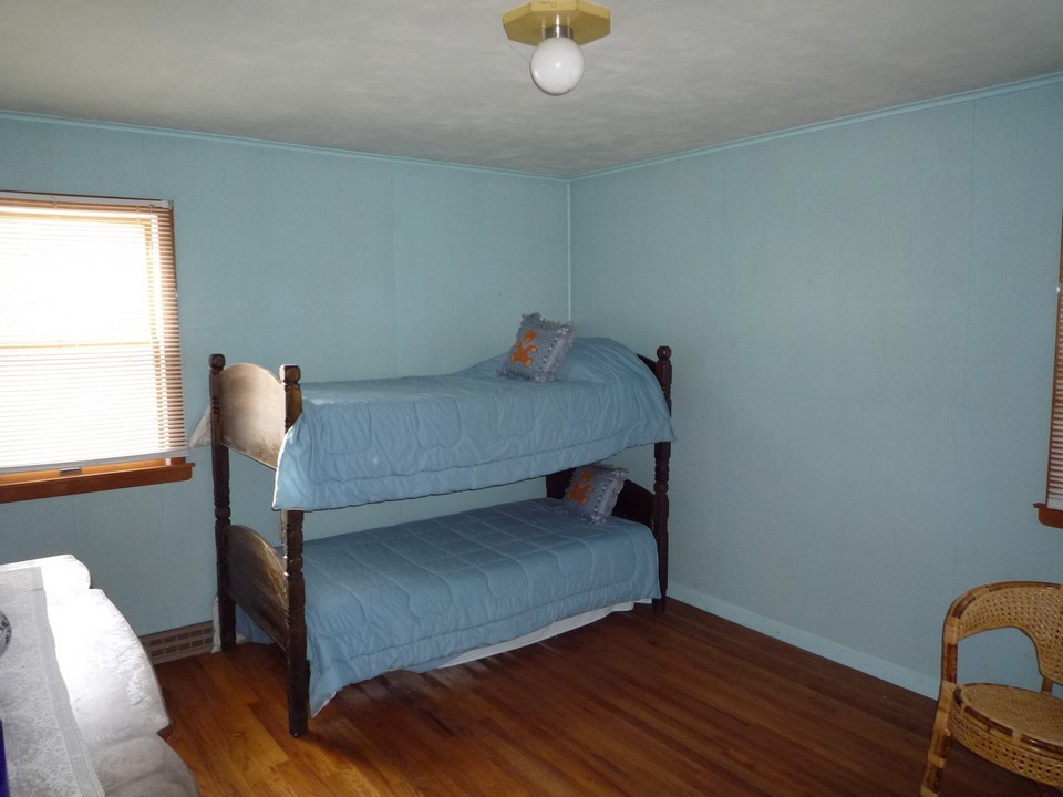 95 Slope Road Tolland, MA 01034 - Photo 13 of 18 a bedroom with a bed and window