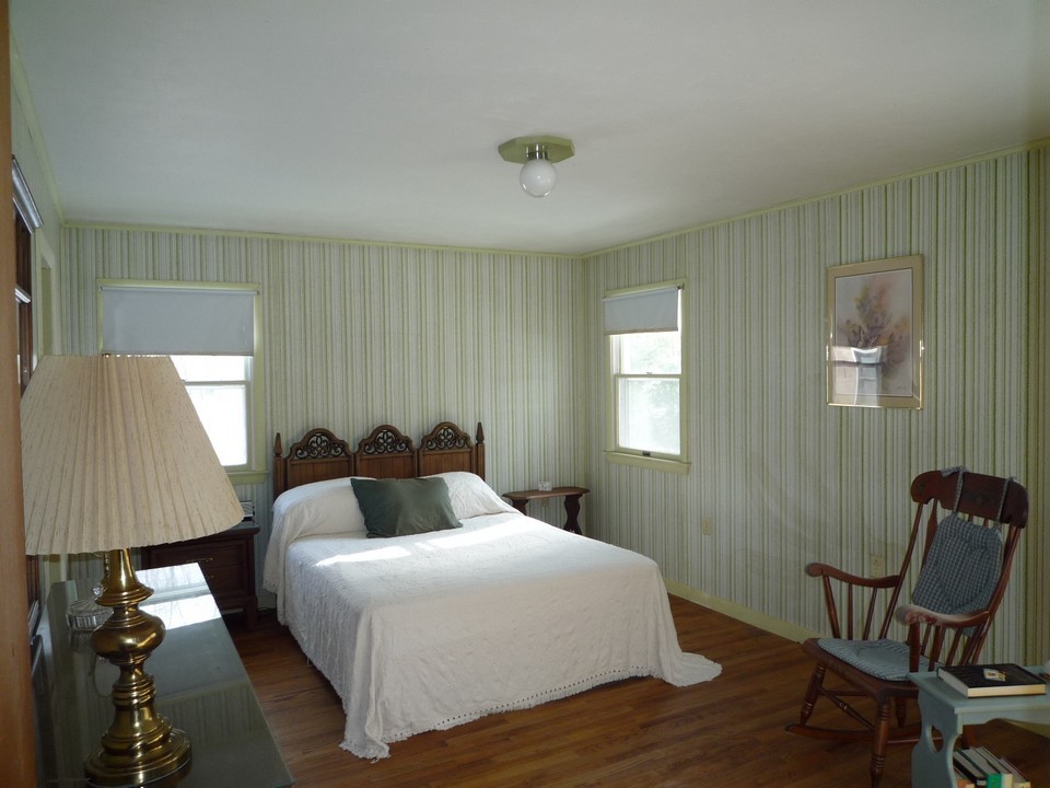 95 Slope Road Tolland, MA 01034 - Photo 14 of 18 a bedroom with a bed and a window