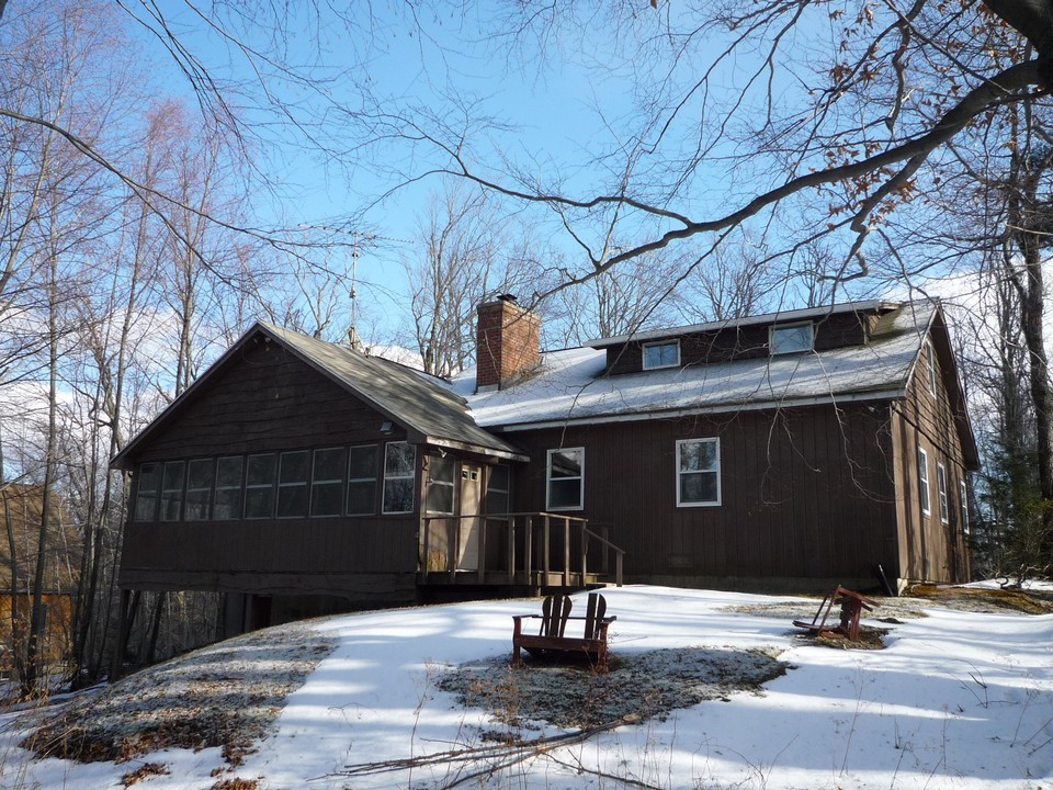 95 Slope Road Tolland, MA 01034 - Photo 3 of 18 a front view of a house with garage