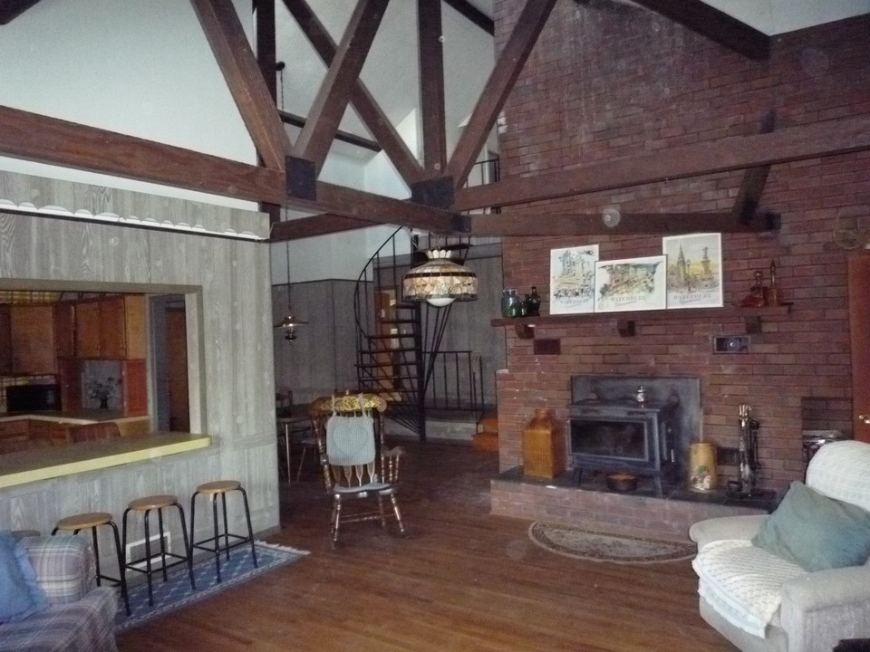 95 Slope Road Tolland, MA 01034 - Photo 7 of 18 a living room with furniture and a fireplace