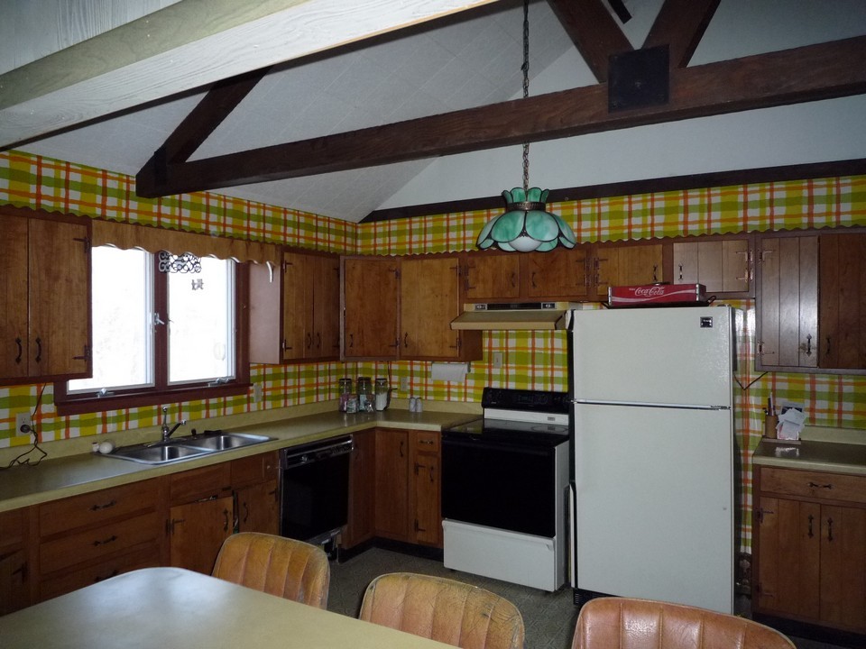 95 Slope Road Tolland, MA 01034 - Photo 10 of 18 a kitchen with a refrigerator and a sink