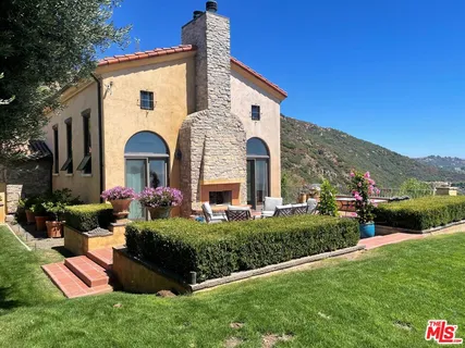a view of a terrace with furniture and stove