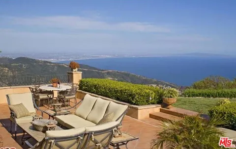 a view of a terrace with sitting area