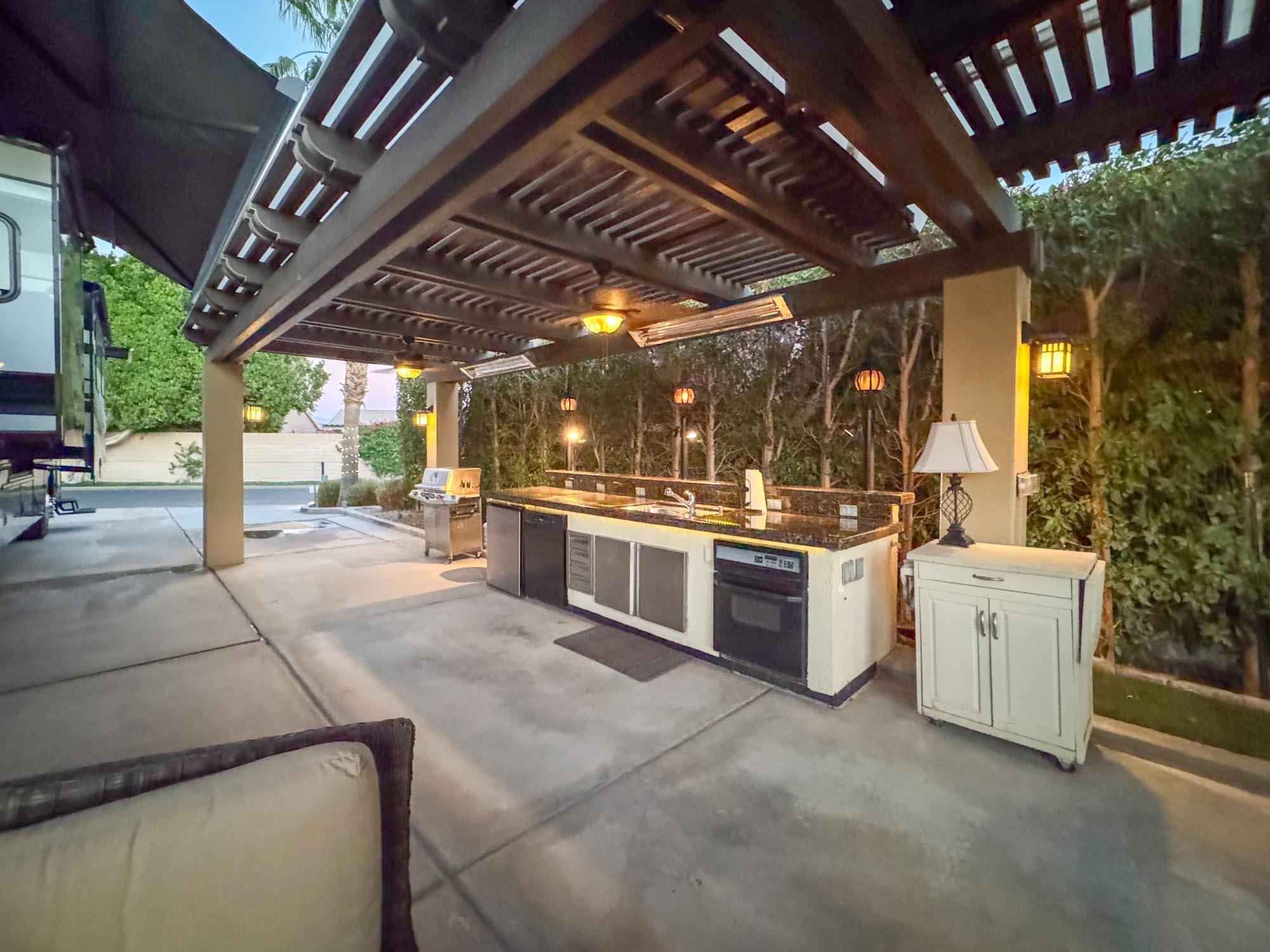 80394 Ave 48, Unit 244 Indio, CA 92201 - Photo 18 of 25 a view of a kitchen with stove and chairs