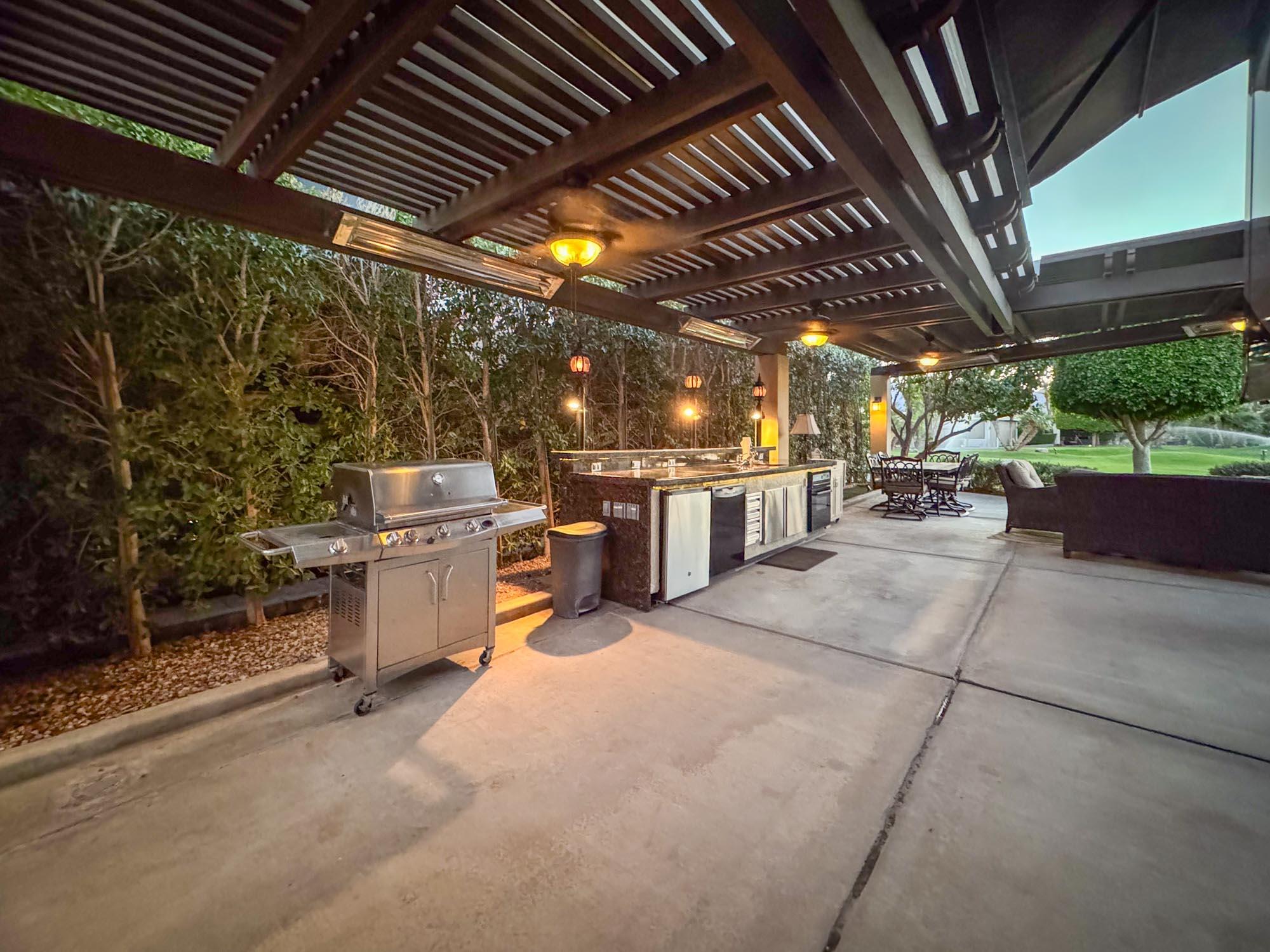 80394 Ave 48, Unit 244 Indio, CA 92201 - Photo 6 of 25 a view of a patio with table and chairs