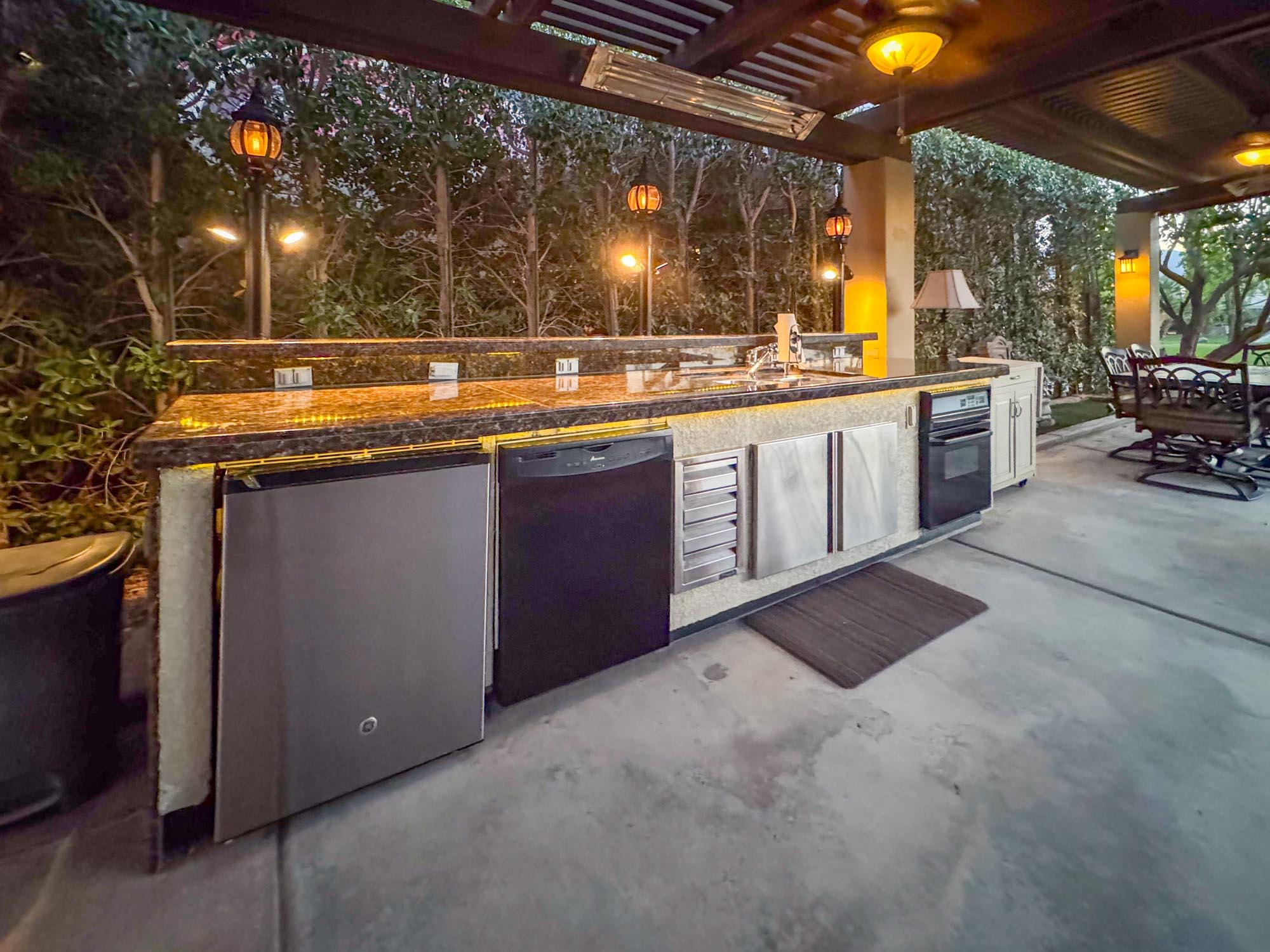 80394 Ave 48, Unit 244 Indio, CA 92201 - Photo 7 of 25 a kitchen with stainless steel appliances granite countertop a sink and a stove