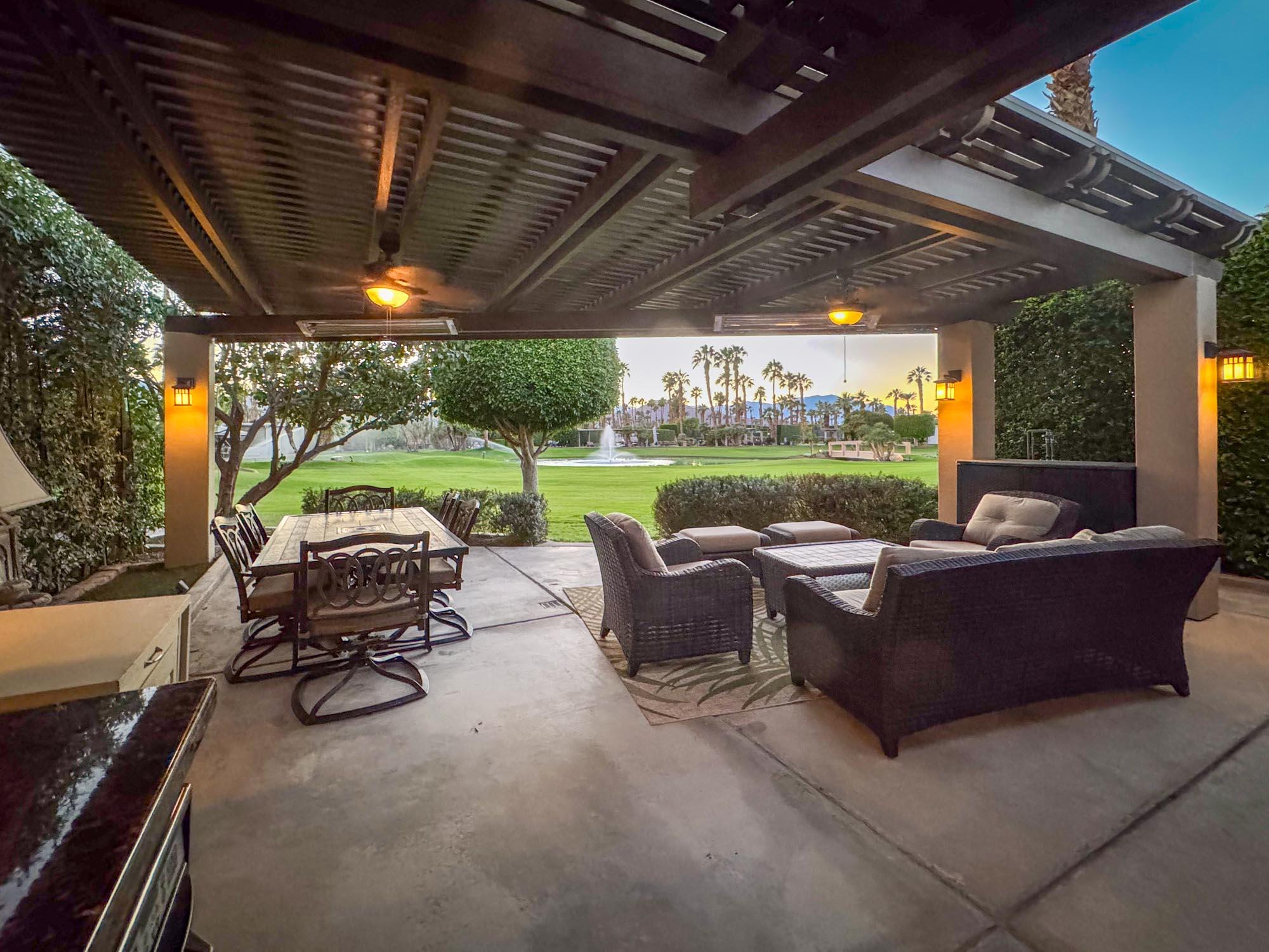 80394 Ave 48, Unit 244 Indio, CA 92201 - Photo 9 of 25 a view of a patio with couches chairs and a yard