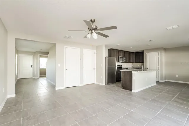 a view of a kitchen with a sink and cabinets