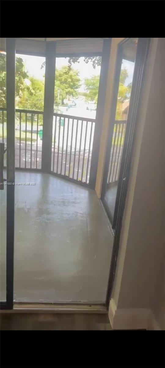 3410 Foxcroft Road, Unit 207 Miramar, FL 33025 - Photo 6 of 18 a view of an empty room with a window
