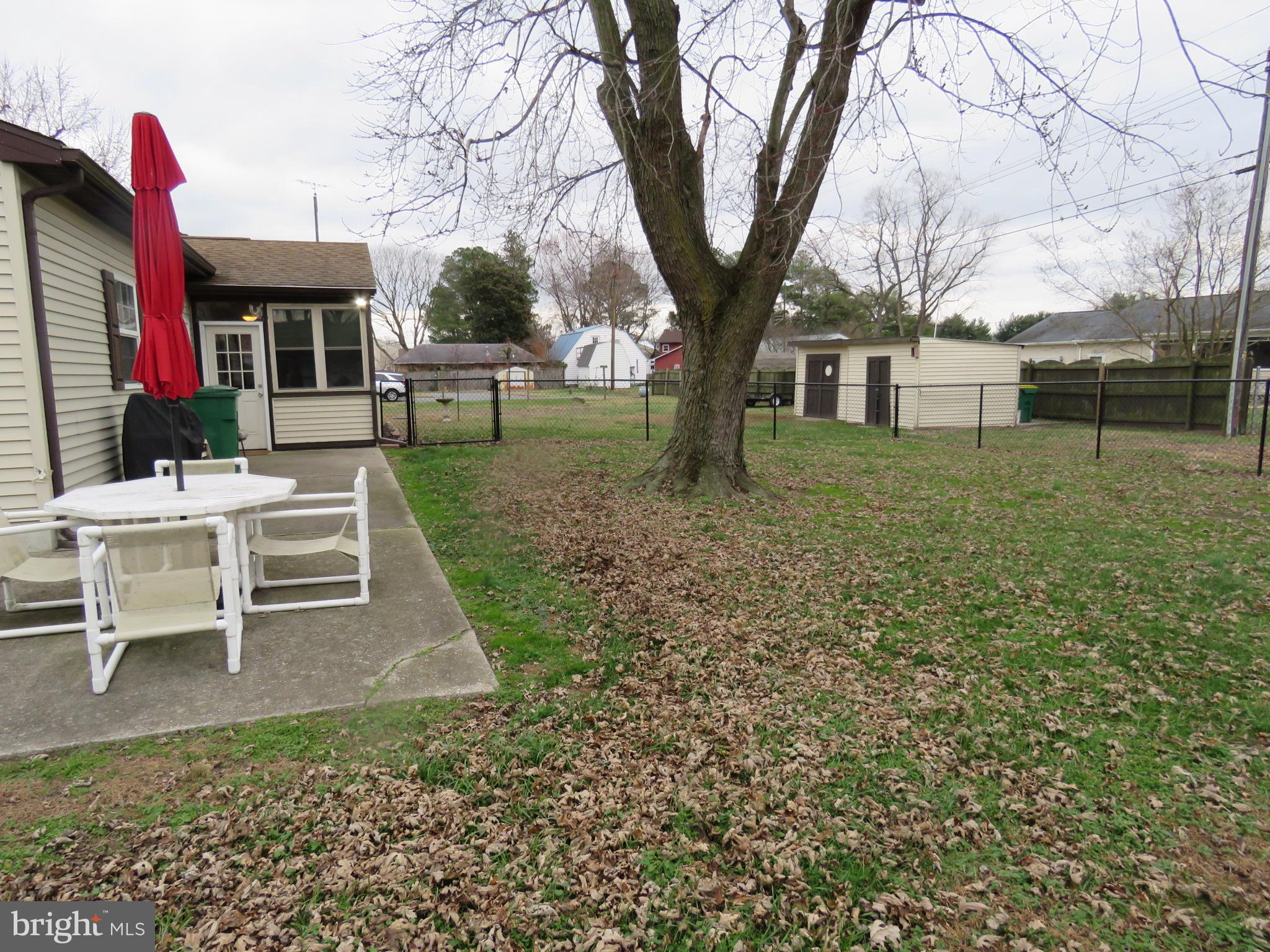 10976 Delaware Avenue Laurel, DE 19956 - Photo 26 of 56 PARTIALLY FENCED BACK YARD WITH PATIO