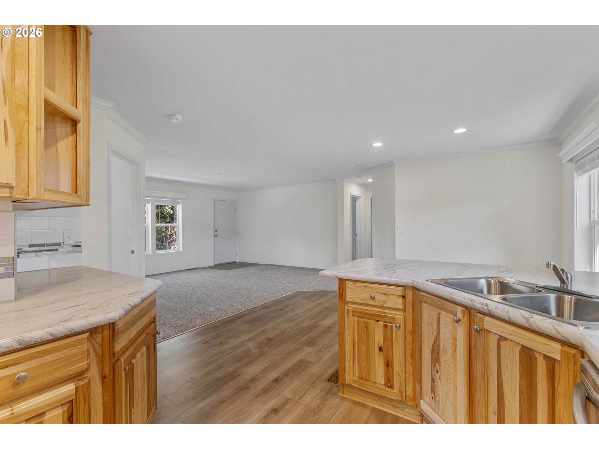 365 Mountain View Road Sweet Home, OR 97386 - Photo 10 of 32 a kitchen with a sink cabinets and wooden floor