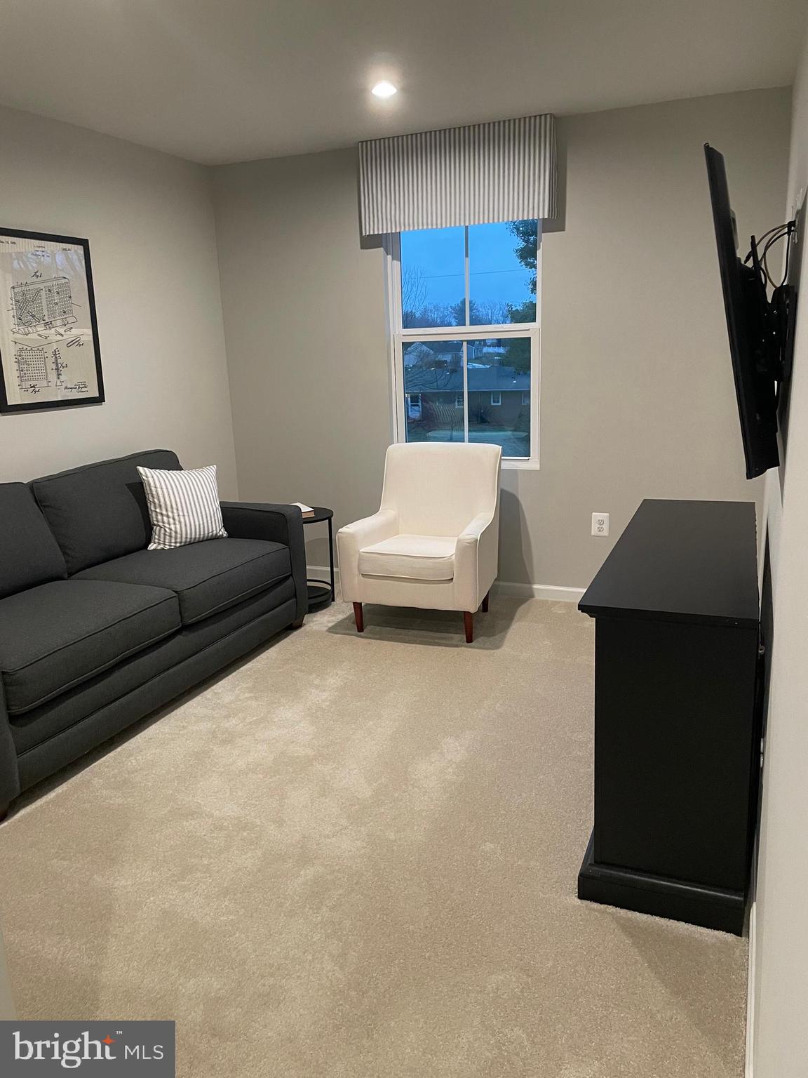2640 High Point Drive Culpeper, VA 22701 - Photo 20 of 27 a living room with furniture and a flat screen tv