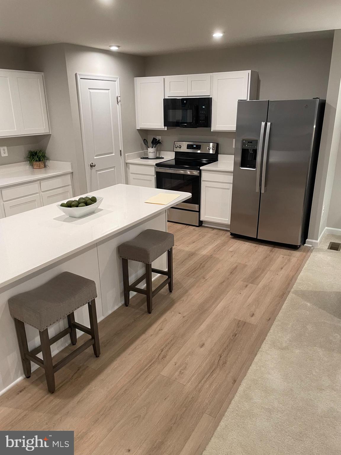 2640 High Point Drive Culpeper, VA 22701 - Photo 5 of 27 a kitchen with stainless steel appliances a stove a sink a microwave and a refrigerator