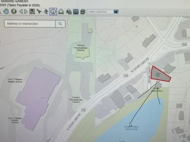 a bathroom with a shower and a sink