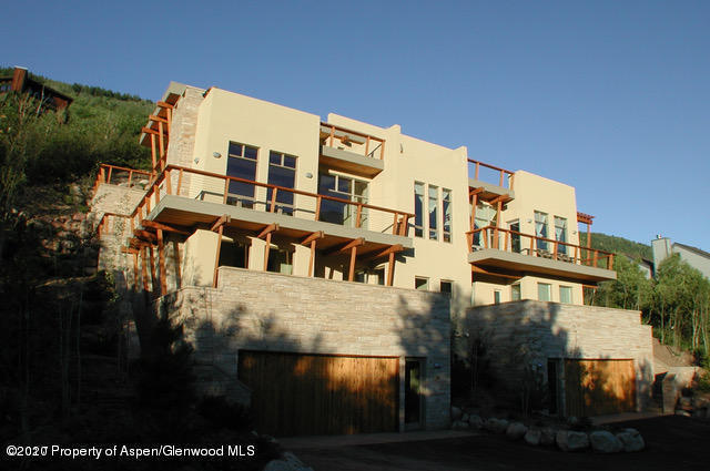 250 Mountain Laurel Drive, Unit A Aspen, CO 81611 - Photo 1 of 10 a front view of a building with a yard