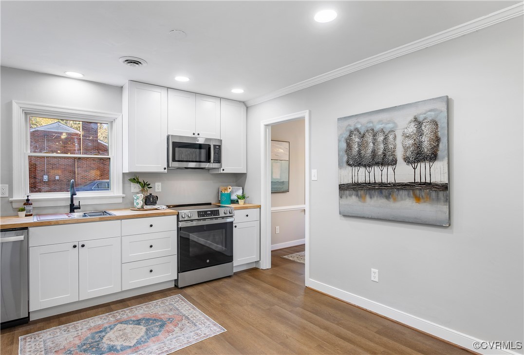 12079 Sunset Drive Ashland, VA 23005 - Photo 11 of 27 a kitchen with stainless steel appliances granite countertop a stove a sink and a microwave