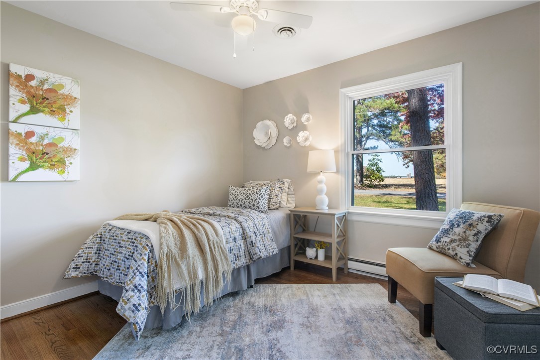 12079 Sunset Drive Ashland, VA 23005 - Photo 19 of 27 a bedroom with a bed and a couch