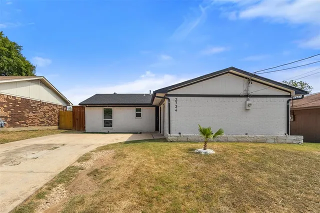 a house with yard in front of it