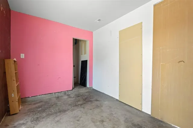 a view of room with closet and windows