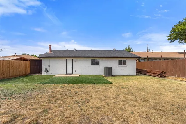 a view of a house with a yard and garage