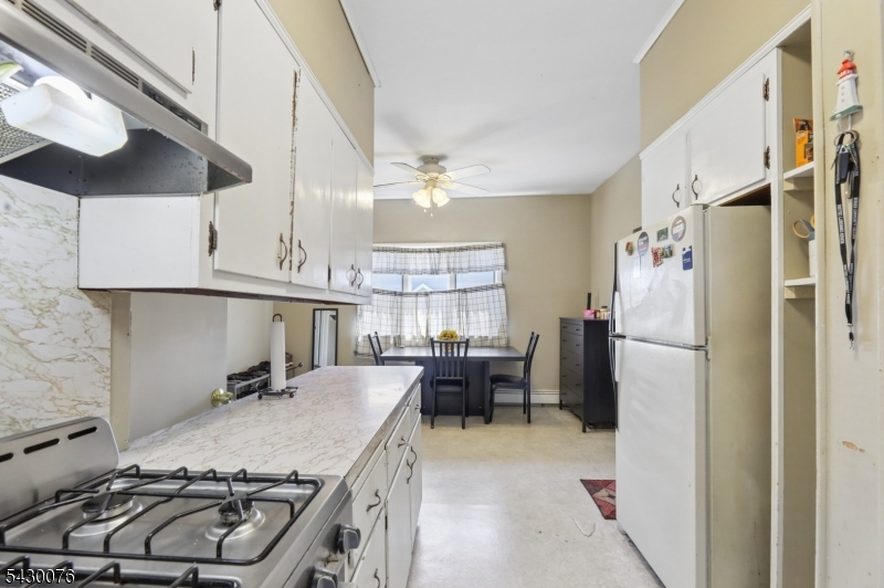 360 Rutherford Boulevard Clifton, NJ 07014 - Photo 5 of 42 a kitchen with stainless steel appliances granite countertop a sink stove and refrigerator