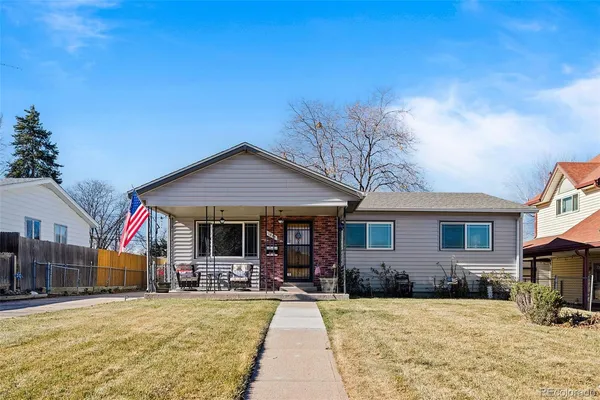 a view of a house with dining room and wooden fence
