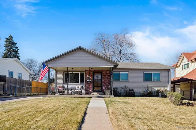 a view of a house with dining room and wooden fence