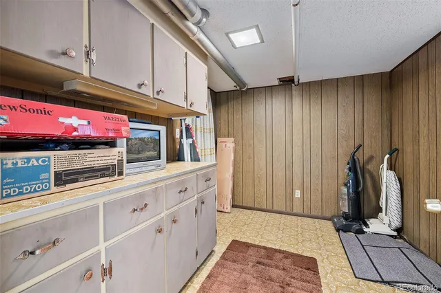 a kitchen with stainless steel appliances kitchen island granite countertop a refrigerator and a stove top oven