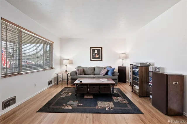 a living room with furniture and a rug