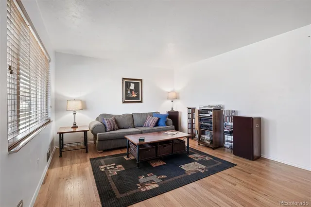 a living room with furniture and a rug