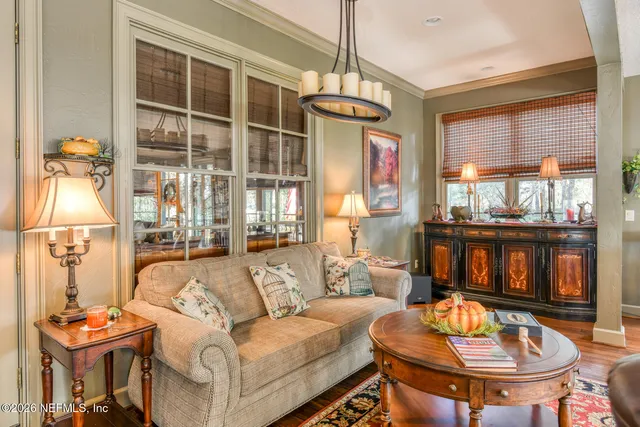 a bedroom with a bed and a large window with outer view