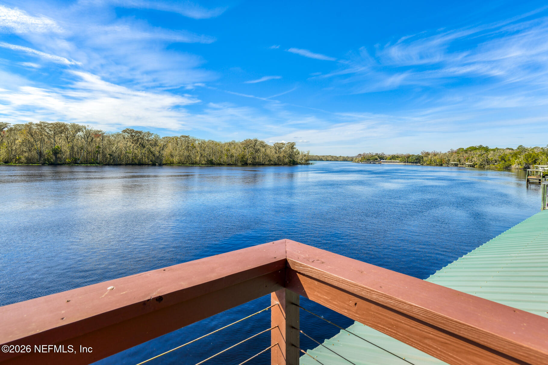 131 Whitney Street Satsuma, FL 32189 - Photo 2 of 75 a view of a lake with sunset