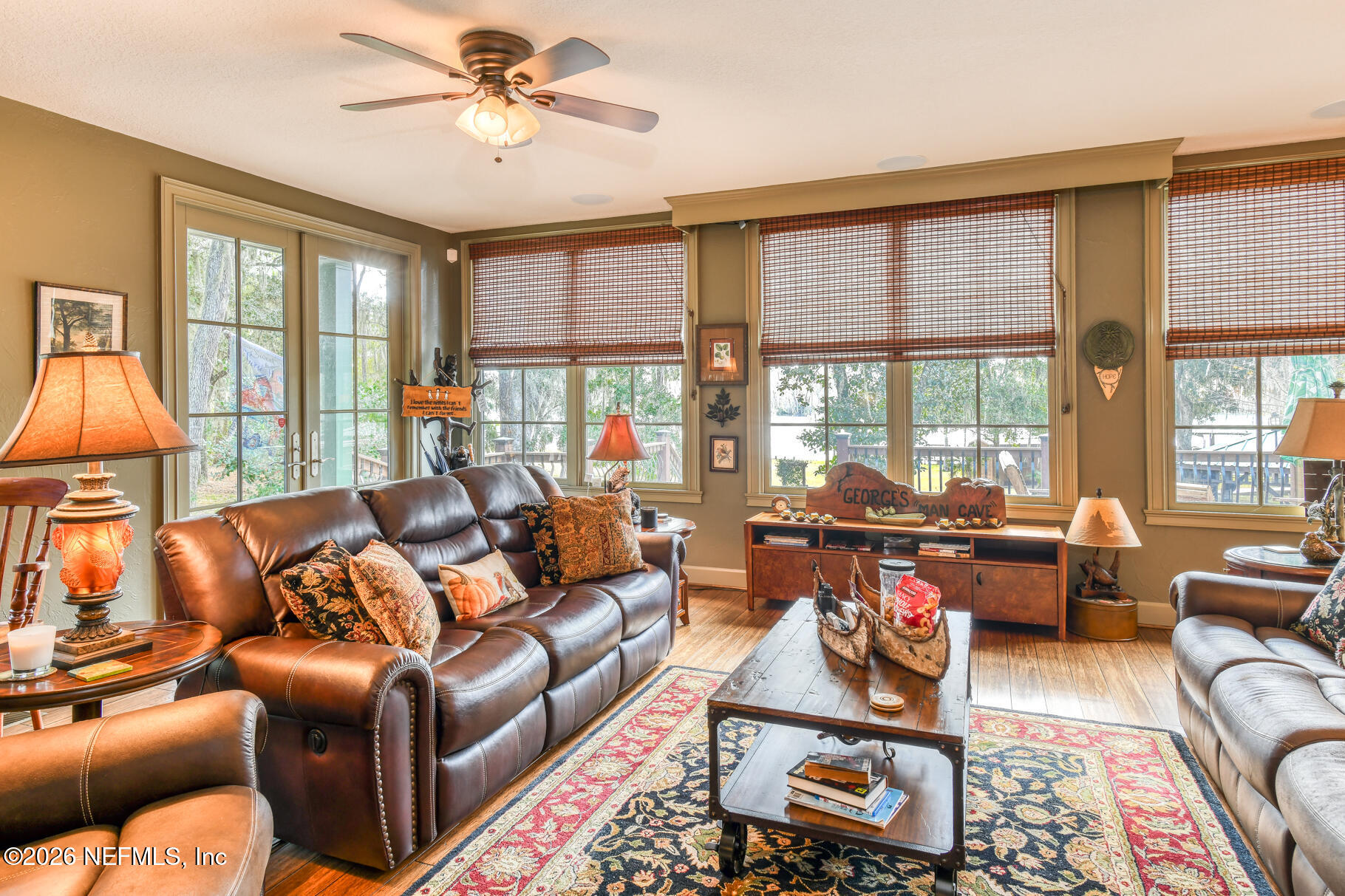 131 Whitney Street Satsuma, FL 32189 - Photo 21 of 75 a living room with furniture and a large window