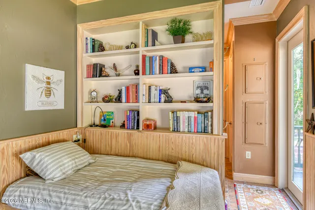 a view of a patio with dining table and chairs with wooden floor and fence