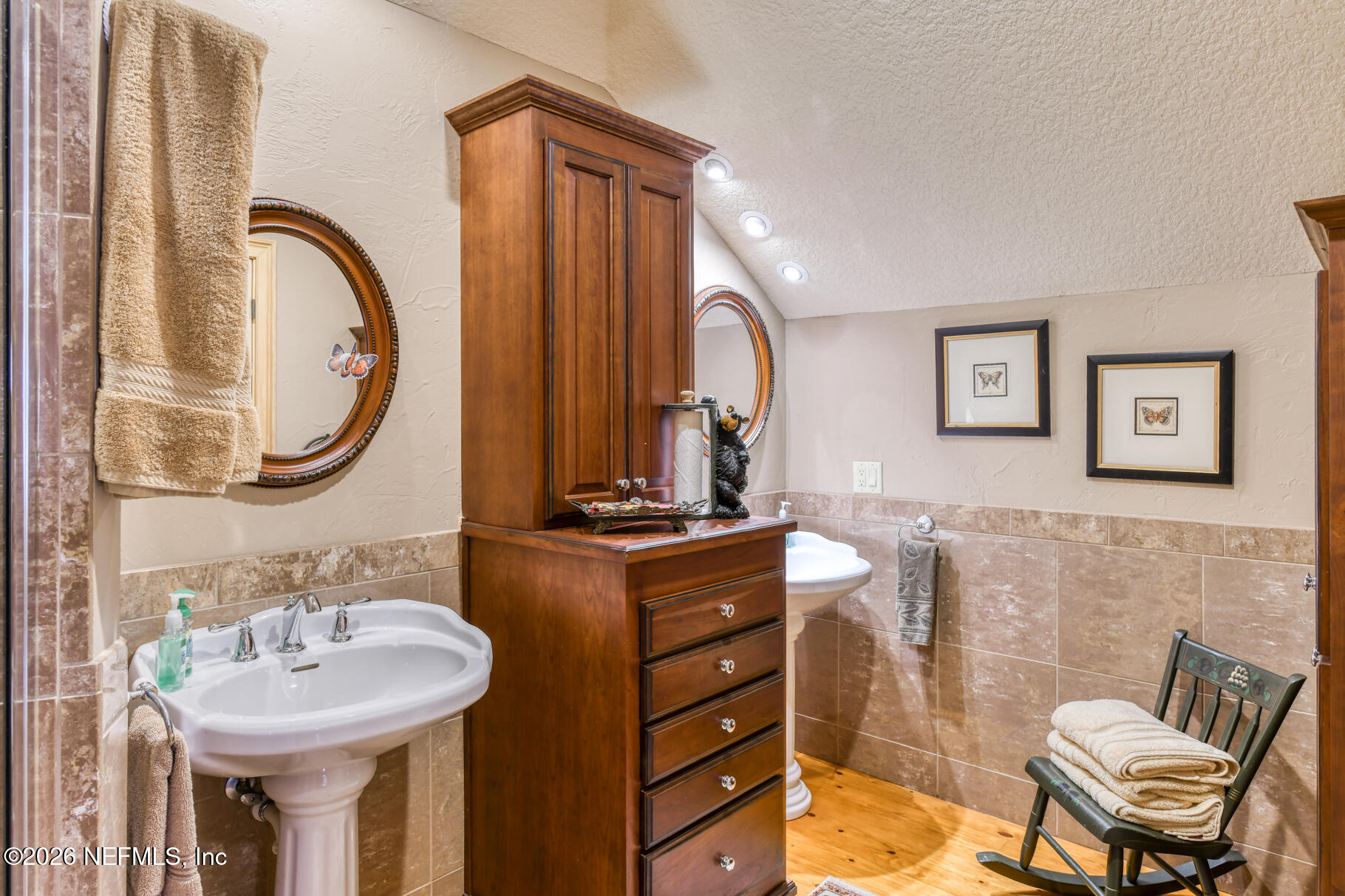 131 Whitney Street Satsuma, FL 32189 - Photo 35 of 75 a bathroom with a sink mirror and a toilet