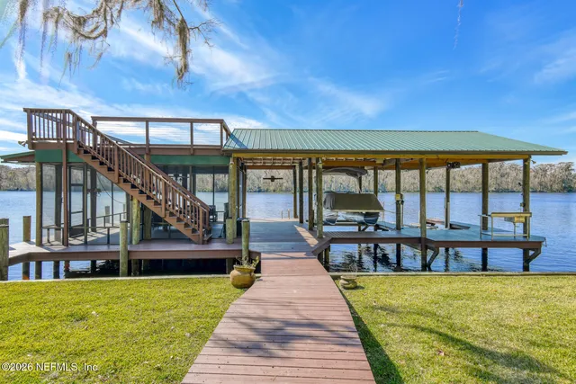 a view of a lake with houses in the back