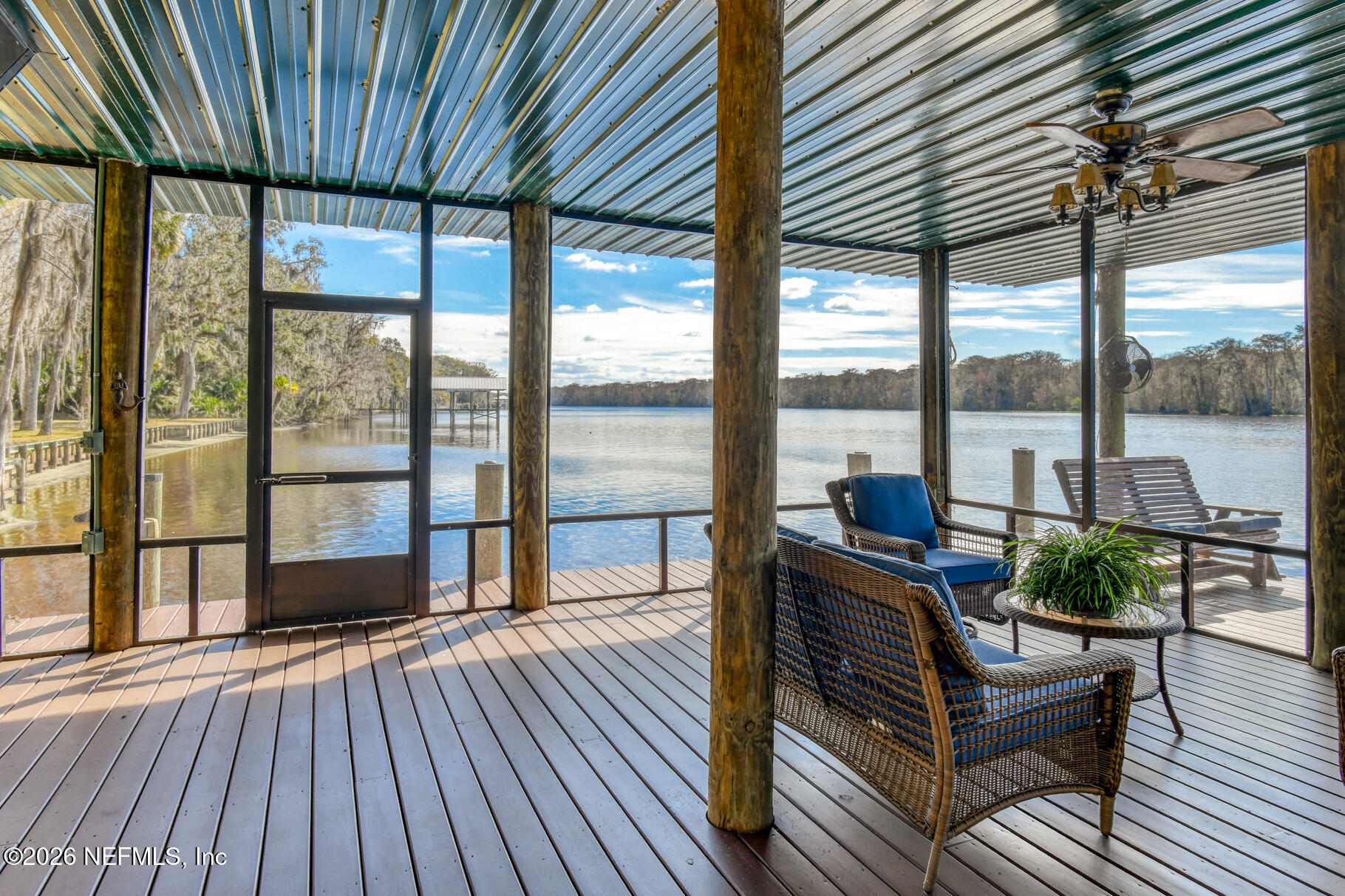 131 Whitney Street Satsuma, FL 32189 - Photo 52 of 75 a living room with furniture and large windows