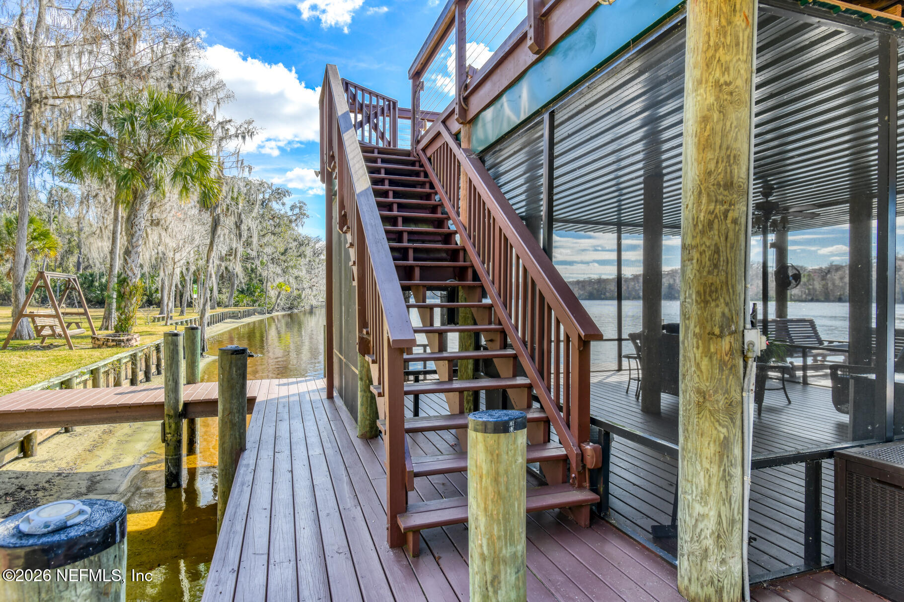 131 Whitney Street Satsuma, FL 32189 - Photo 54 of 75 a view of balcony with wooden floor and seating space