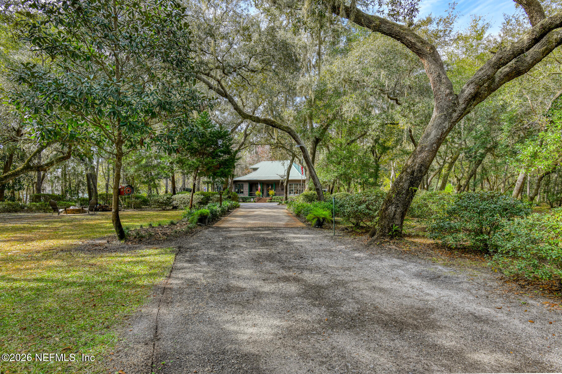 131 Whitney Street Satsuma, FL 32189 - Photo 6 of 75 a view of a park with large trees