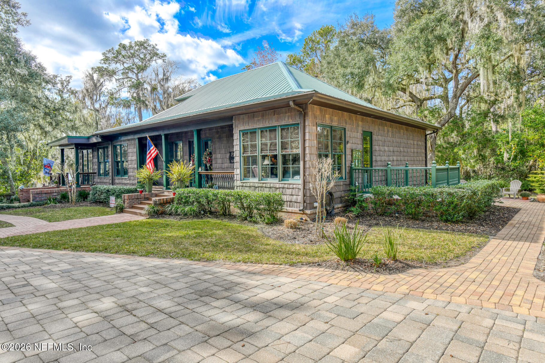 131 Whitney Street Satsuma, FL 32189 - Photo 7 of 75 a front view of a house with garden