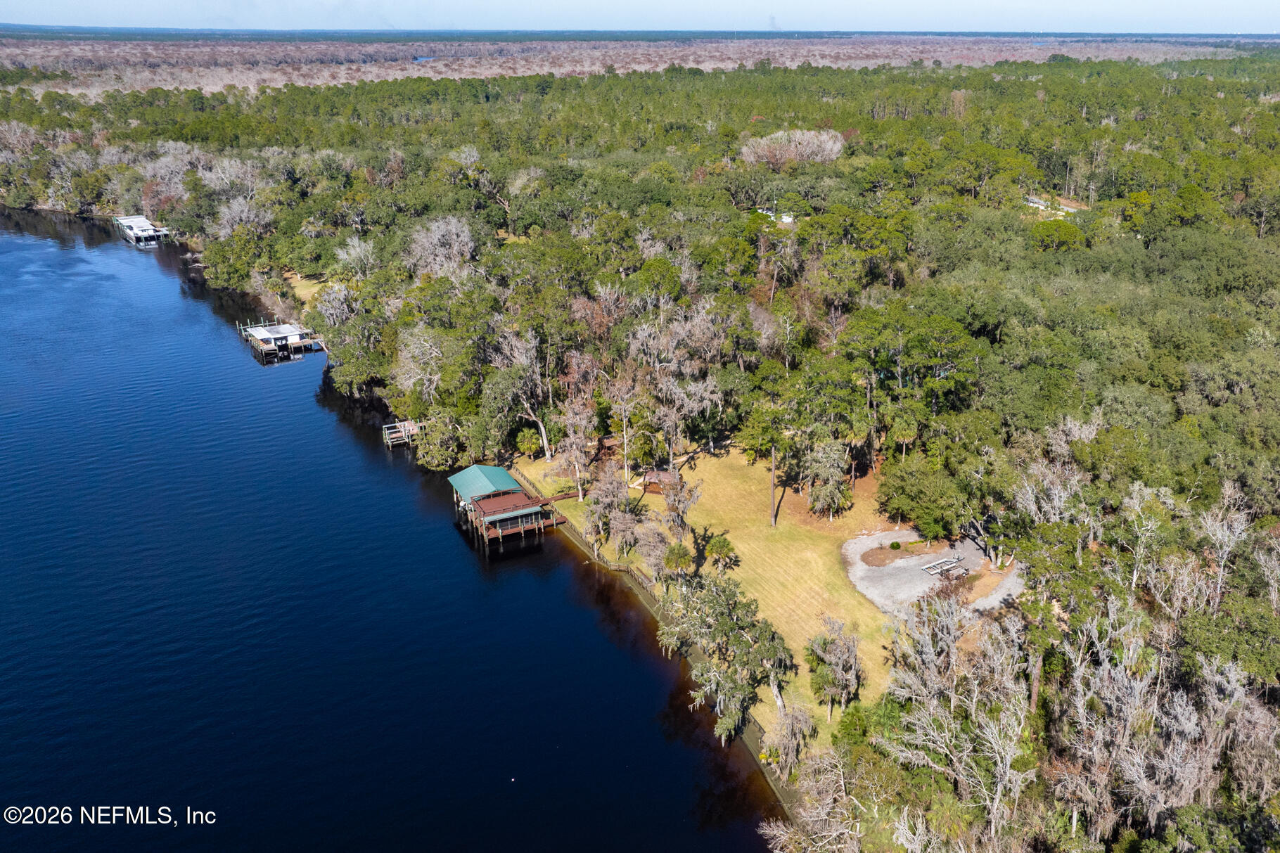 131 Whitney Street Satsuma, FL 32189 - Photo 73 of 75 a view of a lake with a mountain in the background