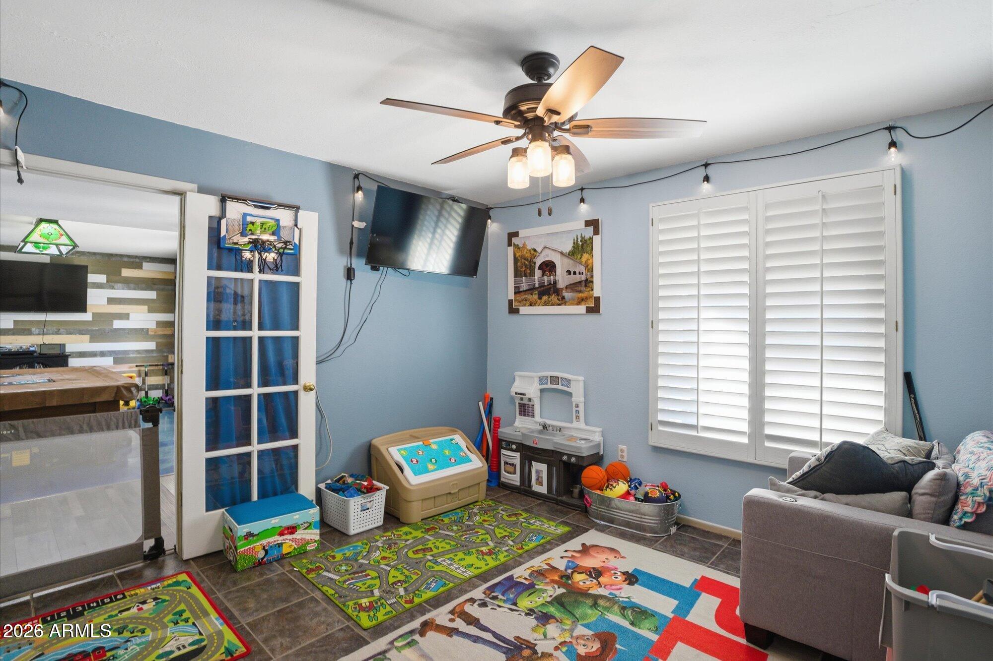 2222 West Maple Drive Phoenix, AZ 85027 - Photo 17 of 32 a bedroom with furniture and a window