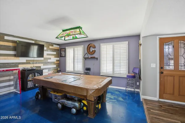 a bedroom with furniture and a window