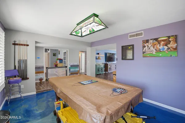 a room with furniture and wooden floor