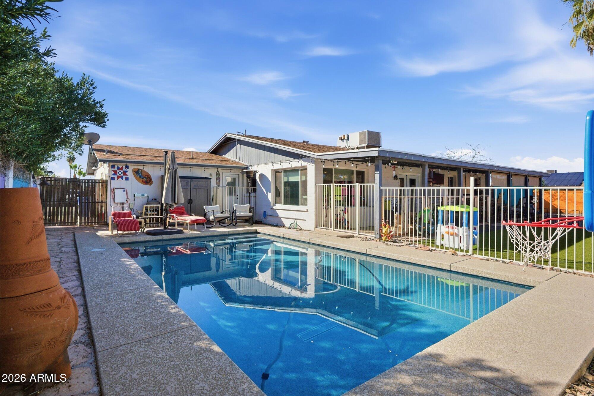2222 West Maple Drive Phoenix, AZ 85027 - Photo 21 of 32 a view of a house with roof deck and furniture