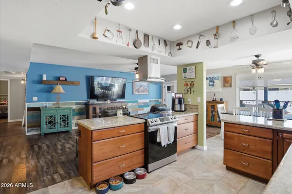 a kitchen with stainless steel appliances granite countertop a sink and cabinets