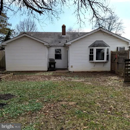 a house view with a backyard space