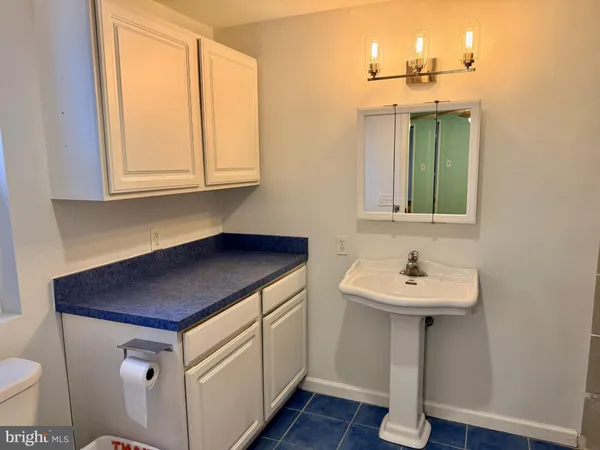 a utility room with a sink washer and dryer